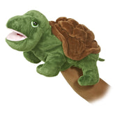Timmer turtle hand puppet by Aurora, made with green fabric and a textured shell